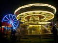 Bright illuminated lights from festival rides