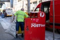 Australia Post postal worker collecting mails from the mal box