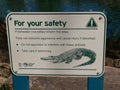 AUSTRALIA, QUEENSLAND, BOODJAMULLA NATIONAL PARK, MAY 19, 2010: Metal plate with safety instructions for visitors and swimmers of