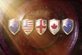 Australia, us, great britain,canada, and new zealand flags in golden shield on copper texture background.5 eyes alliance
