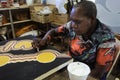 Aboriginal female artist dot painting