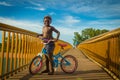 Australian aboriginal kid in a cycle.