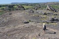 Woman tourist hiking at Ubirr rock art site in Kakadu National Park Northern Territory of Australia Royalty Free Stock Photo