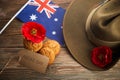 Australian Anzac Day. Australian army slouch hat and traditional Anzac biscuits on wooden background. Royalty Free Stock Photo