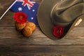 Australian Anzac Day. Australian army slouch hat and traditional Anzac biscuits on wooden background. Royalty Free Stock Photo
