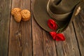 Australian Anzac Day. Australian army slouch hat red poppy and traditional Anzac biscuits on wooden background. Royalty Free Stock Photo