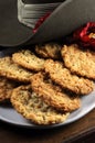 Australian army slouch hat and traditional Anzac biscuits on dark recycled wood - vertical close up Royalty Free Stock Photo