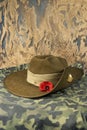 Australian diggers slouch hat on a camouflage background.