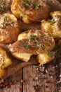Australian baked crash hot potatoes with thyme close-up. Vertical