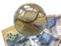 Australian banknotes, coin and a crystal ball