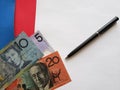 australian banknotes, black pen and white sheet of paper Royalty Free Stock Photo