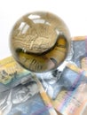 Australian banknotes, coin and crystal ball on whitebackround