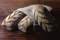 Australian bread inside rustic bag over rustic wooden background. Traditionally this bread is made with chocolate powder, brown