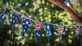 Australian and british flag bunting in sunny garden setting Royalty Free Stock Photo