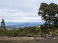 Australian bush clearing, featuring distant rolling hills, rugged landscape and patchy woodlands Royalty Free Stock Photo