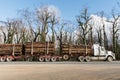 Australian bushfires aftermath: a truck with burned pines logs which was badly damaged by severe bushfires