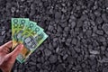 Australian currency showed on coal of mine deposit mineral resources background Royalty Free Stock Photo