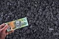 Australian currency showed on coal of mine deposit mineral resources background Royalty Free Stock Photo