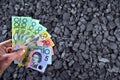 Australian currency showed on coal of mine deposit mineral resources background Royalty Free Stock Photo