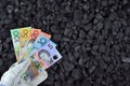 Australian currency showed on coal of mine deposit mineral resources background Royalty Free Stock Photo