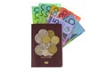 Australian dollar banknote AUD and coins on Passport isolated Royalty Free Stock Photo