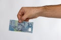 10 Australian dollar Banknote in back hand Royalty Free Stock Photo