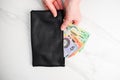 Australian dollar banknotes in a black wallet on the white background Royalty Free Stock Photo