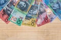 Australian dollar banknotes in fan on wooden background Royalty Free Stock Photo