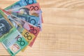 Australian dollar banknotes in fan on wooden background Royalty Free Stock Photo