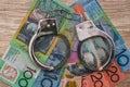 Australian dollar banknotes with handcuffs Royalty Free Stock Photo