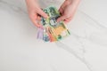 Australian dollar banknotes in the hands. on the white background Royalty Free Stock Photo