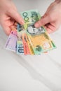 Australian dollar banknotes in the hands. on the white background Royalty Free Stock Photo