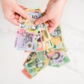 Australian dollar banknotes in the hands. on the white background Royalty Free Stock Photo