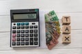 Australian dollar banknotes with wooden cubes and calculator Royalty Free Stock Photo