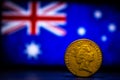 Australian dollar coin isolated on Australia flag background with space for copy text. One dollar coin 1995 Australian currency. Royalty Free Stock Photo