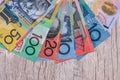 Australian dollars in fan on wooden table. Royalty Free Stock Photo