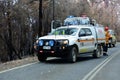 Australian fire fighters blocking a road during a large bush fire