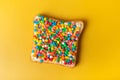 Australian food Fairy Bread on a yellow background