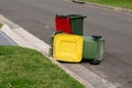 Australian garbage wheelie bins with colourful lids