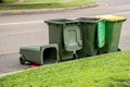 Australian garbage wheelie bins with colourful lids for recycling and general household waste