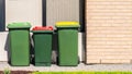 Australian home wheelie bins set on front yard