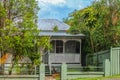 Australian house with tin roof and tropical greenery around it