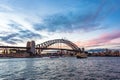 Australian iconic landmark Sydney Harbour Bridge against picturesque sunset sky Royalty Free Stock Photo