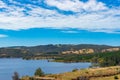 Australian landscape of lake, dam, and eucalyptus on hills Royalty Free Stock Photo