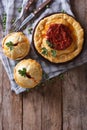 Australian meat pie on a table. vertical top view