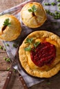 Australian meat pie on the table, vertical view from above