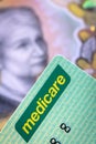 Australian Medicare Card over Blurred Money Background Royalty Free Stock Photo