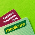 Australian Medicare and Pensioner Concession Cards over Vibrant Green Background Royalty Free Stock Photo