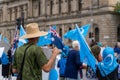 Australian men holding Australian flag in a pro-Uyghur demonstration