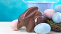 Australian milk chocolate Bilby Easter egg with eggs in nest and copy space. Royalty Free Stock Photo